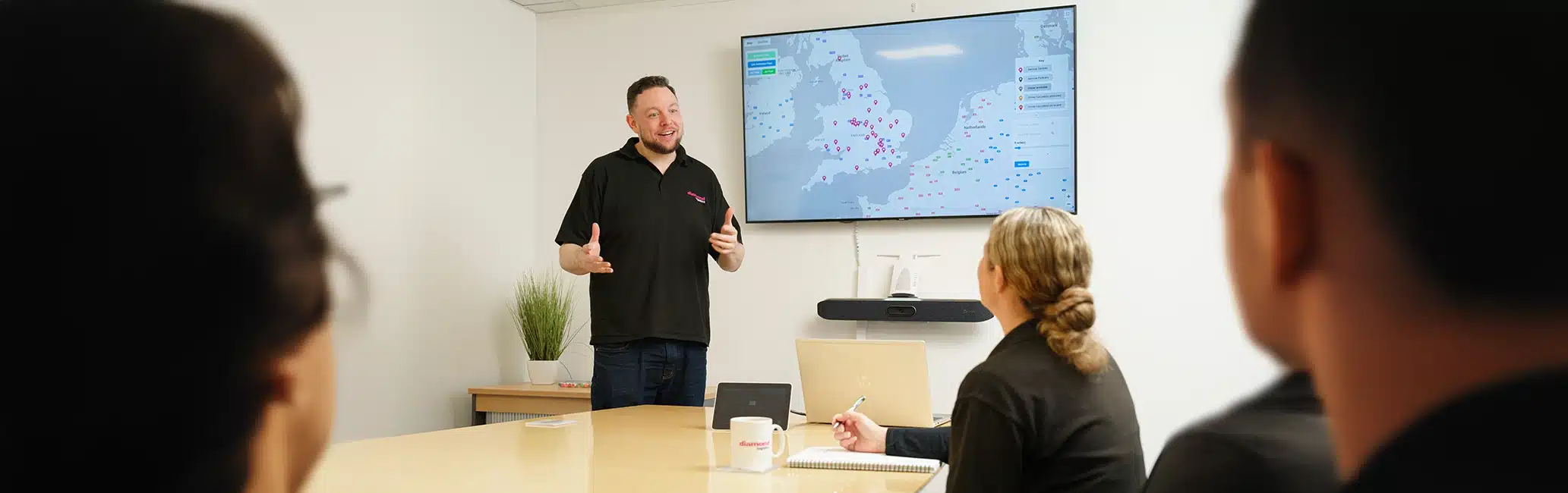 A presentation takes place in the Diamond Logistics office
