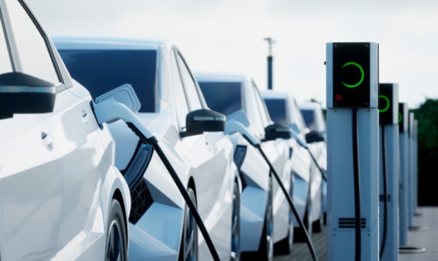 A row of e-vehicles charging