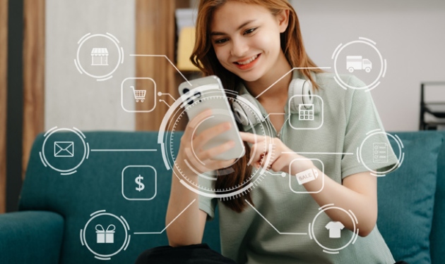 Stock image of a woman ordering products from her smartphone